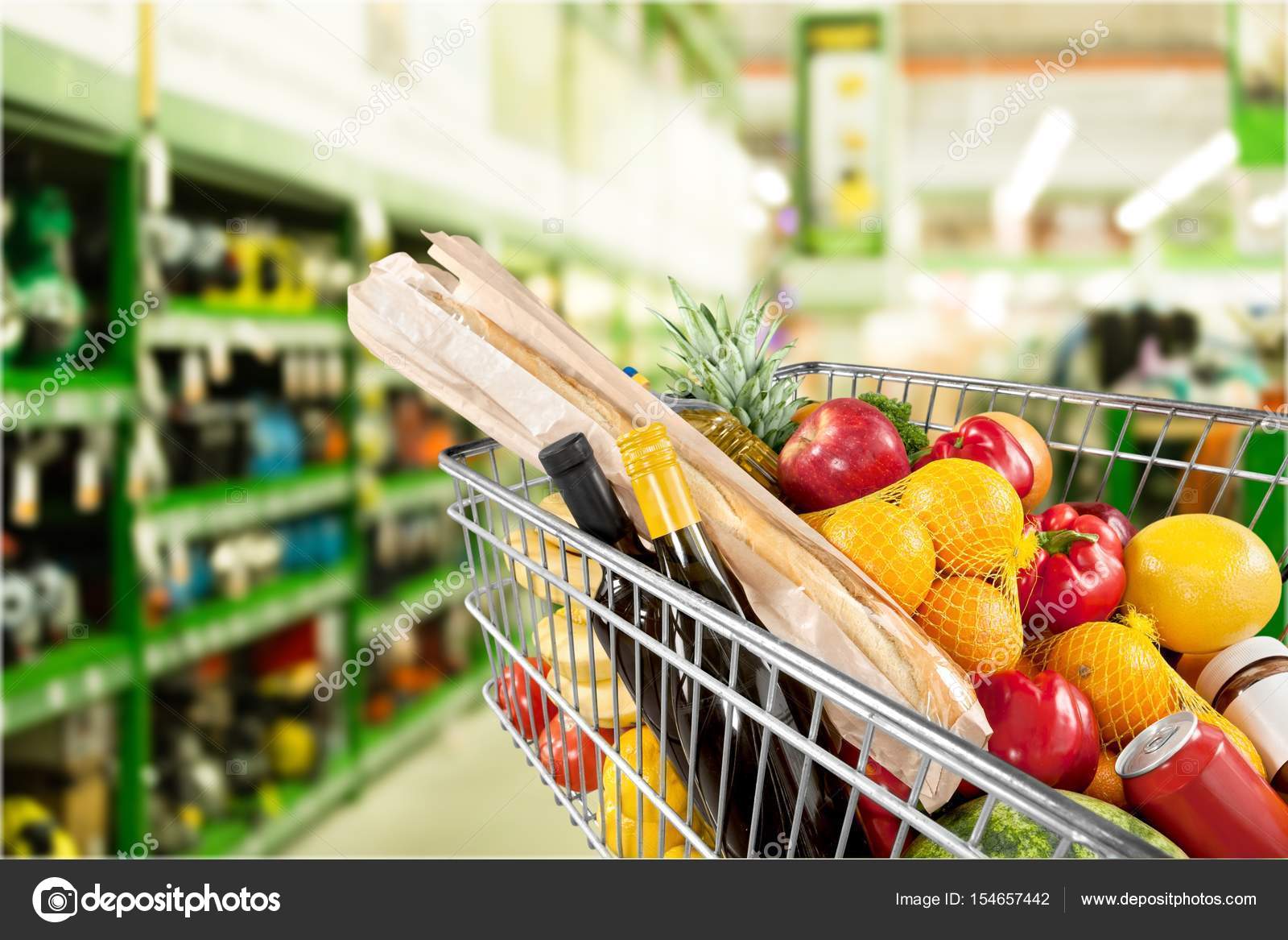 Shopping cart full of groceries Stock Photo by ©billiondigital 154657442