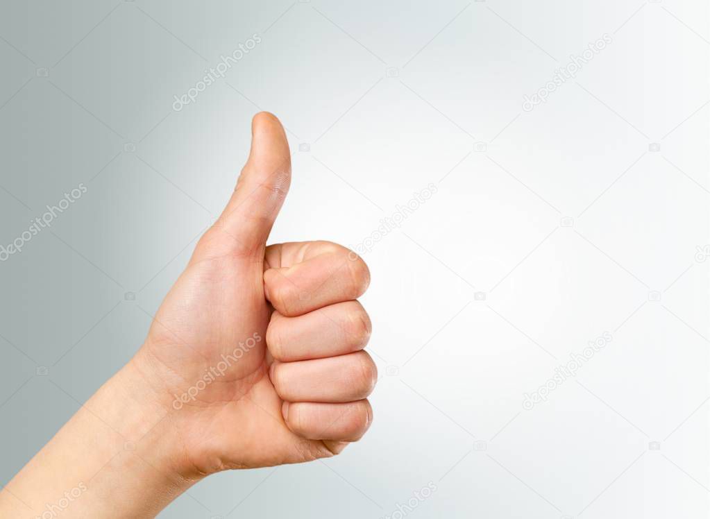 male hand showing thumbs up