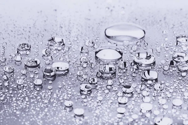 Water drops on silver — Stock Photo, Image