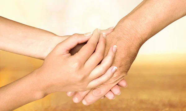 Hands of  old man and a young woman — Stock Photo, Image