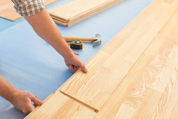 Man laying a new floor