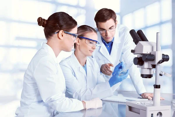 Scientists Working with Microscope — Stock Photo, Image