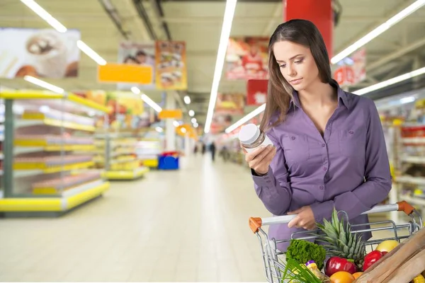 Woman with shopping cart — Stock Photo, Image