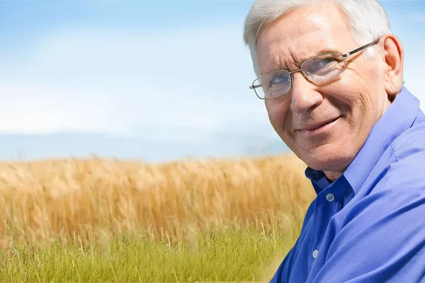 Senior man on green field — Stock Photo, Image