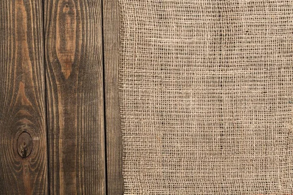 Płótnie tekstury na drewnianym stole — Zdjęcie stockowe