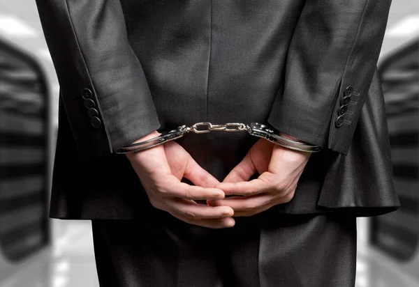 Man in handcuffs behind his back — Stock Photo, Image