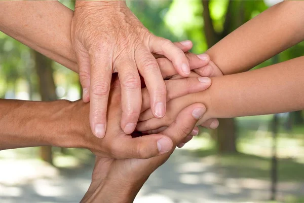 Old and young hands — Stock Photo, Image