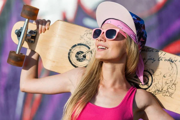 Young happy woman with longboard — Stock Photo, Image