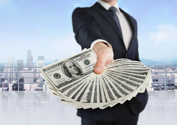Businessman with money in hand — Stock Photo, Image