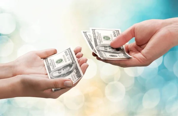 Hands with one hundred dollars — Stock Photo, Image