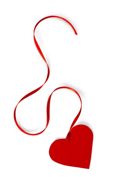 Червоне паперове серце зі стрічкою — стокове фото