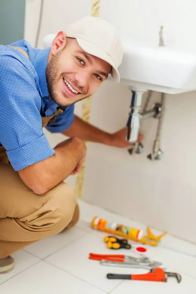 Man in work uniform with tools — Stock Photo, Image