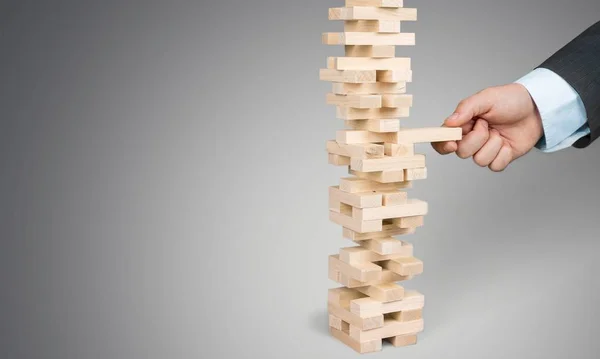 Wood blocks stack game with Hand — Stock Photo, Image