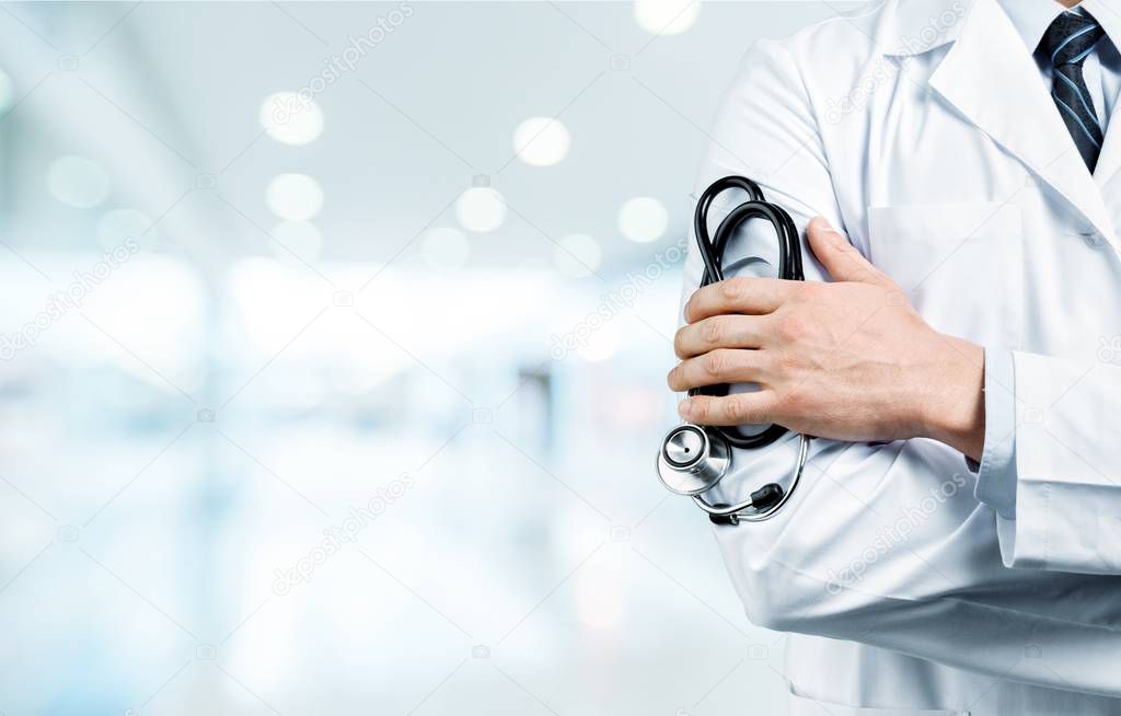 doctor holding stethoscope  