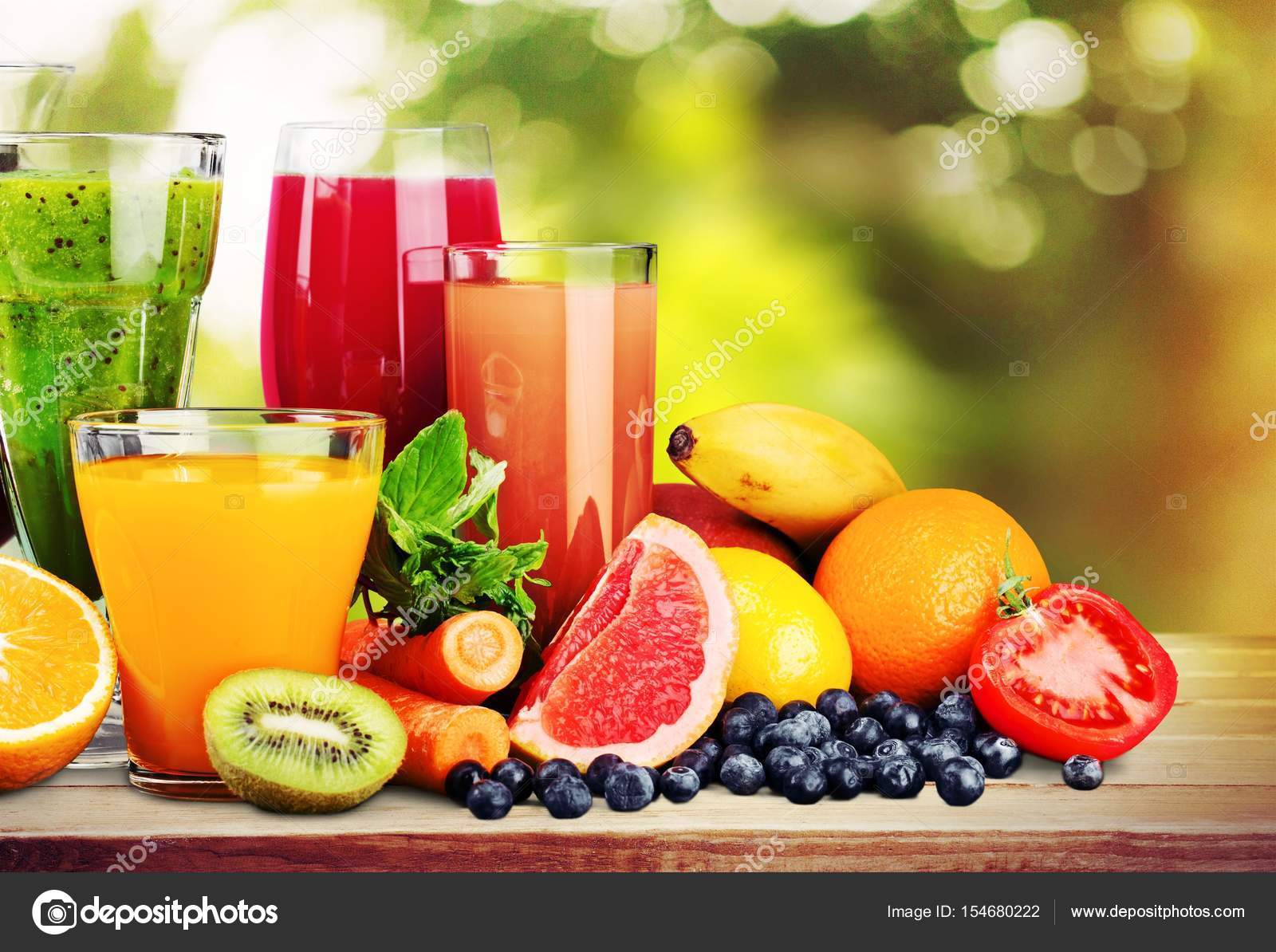 Composition of fruits and glasses of juice Stock Photo by ©billiondigital  154680222