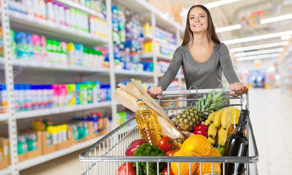 woman pushing shopping cart