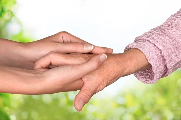 Old and young hands — Stock Photo, Image