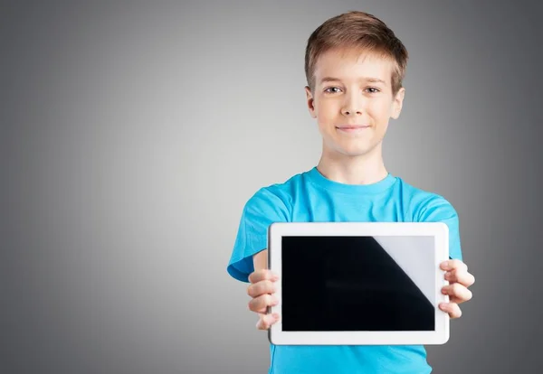 Cute boy with tablet computer — Stock Photo, Image