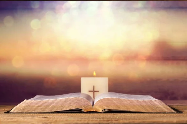 Holy bible with candle — Stock Photo, Image