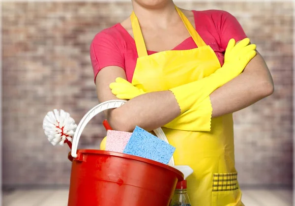 Woman with cleaning supplies — Stock Photo, Image