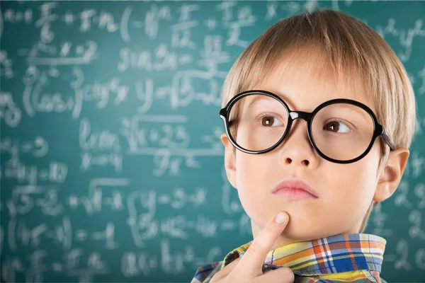 Young boy in  glasses thinking — Stock Photo, Image