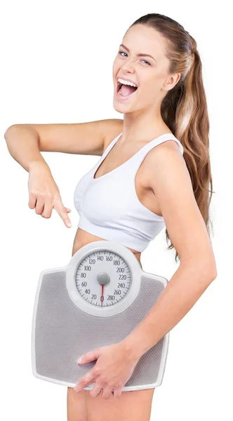 Młoda kobieta trzyma wagi — Zdjęcie stockowe