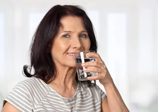 Woman drink water from glass — Stock Photo, Image