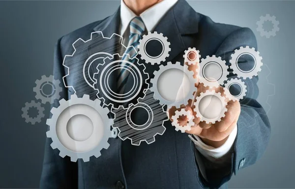 Male hand and Heap of gears — Stock Photo, Image