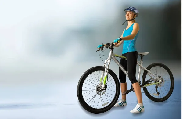 Attractive woman with bike — Stock Photo, Image