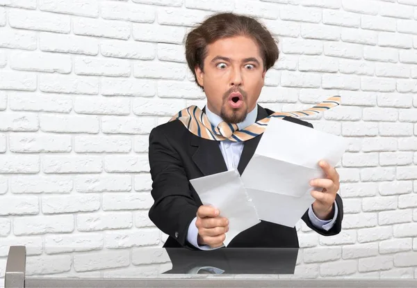 Stressed businessman with documents — Stock Photo, Image