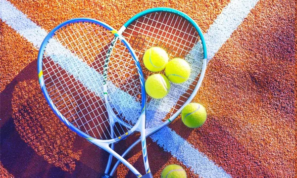 Tennis balls and rackets on  background. — Stock Photo, Image