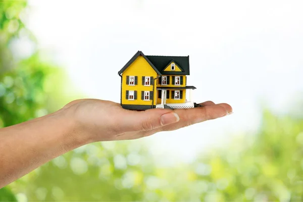 Hand holding house model — Stock Photo, Image