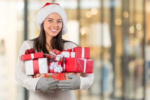 Young woman with christmas gifts — Stock Photo, Image