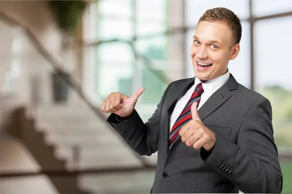 Happy business man in grey suit — Stock Photo, Image