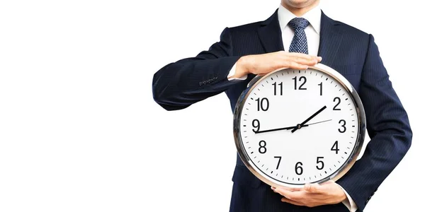 Businessman holding clock in hands — Stock Photo, Image