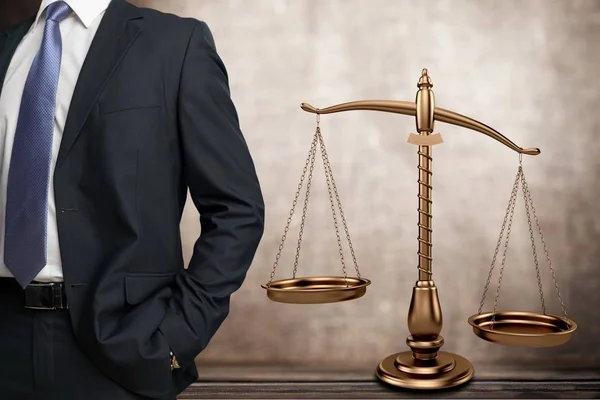 Lawyer standing near Scales of Justice — Stock Photo, Image