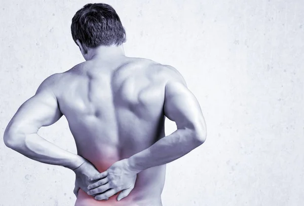 Hombre fuerte con dolor de espalda — Foto de Stock