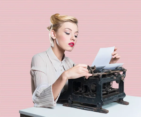 Woman working on vintage typewriter