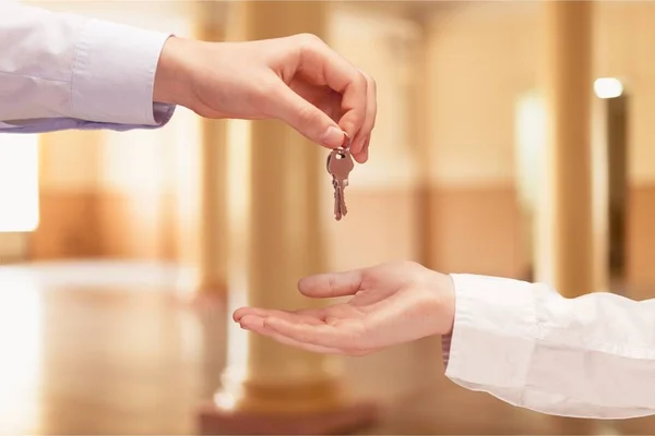 Hand giving set of house keys — Stock Photo, Image