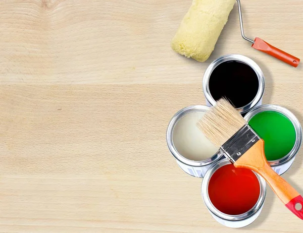 Paint brushes and paint cans — Stock Photo, Image