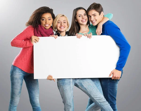 Students with blank sign — Stock Photo, Image