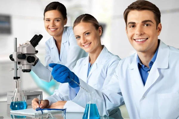 Scientists Working with Microscope — Stock Photo, Image