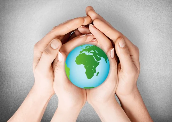 Woman and man holding green globe — Stock Photo, Image