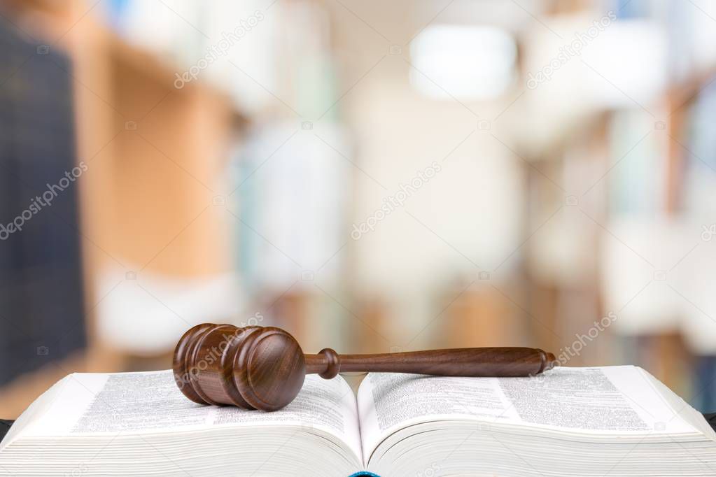 Wooden judge gavel and book