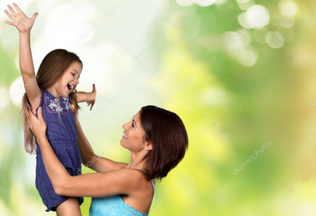 Mother and daughter hugging  