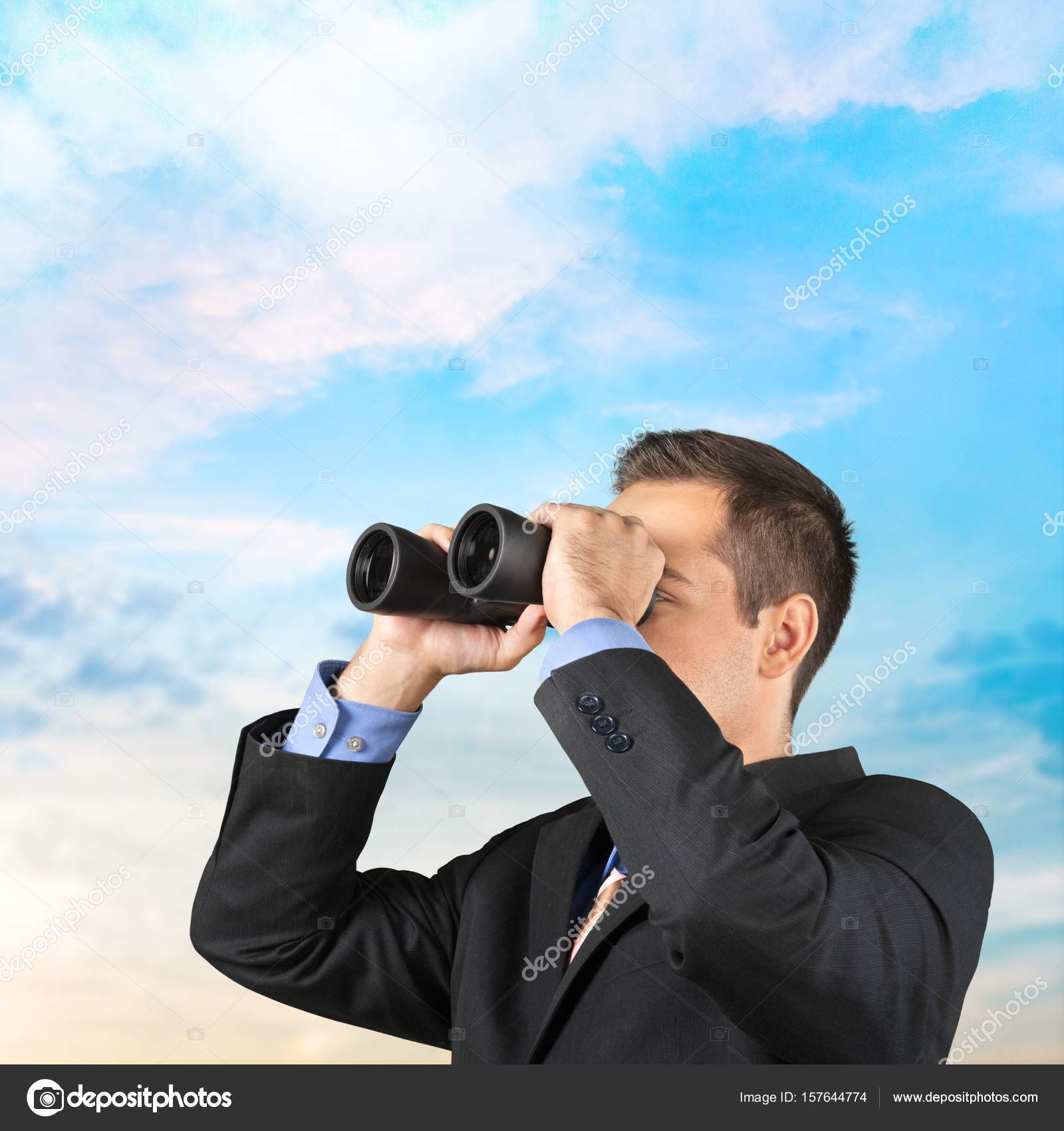 looking with binoculars