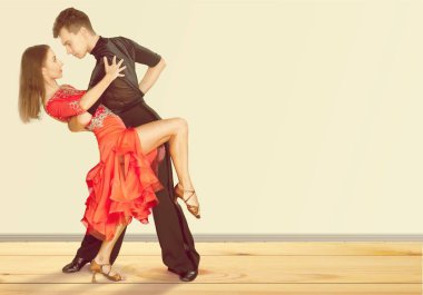 Man and a woman dancing Salsa clipart