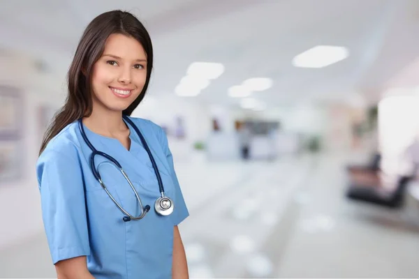 Doctor en uniforme azul con estetoscopio — Foto de Stock