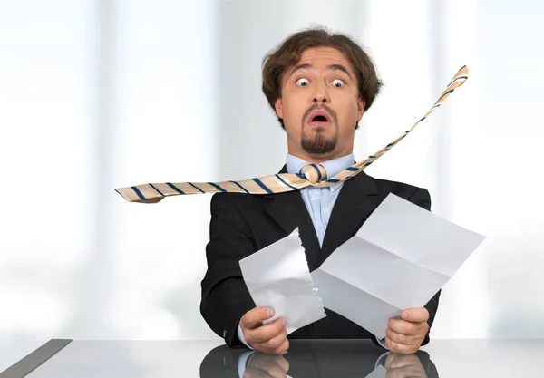 Stressed man with papers — Stock Photo, Image