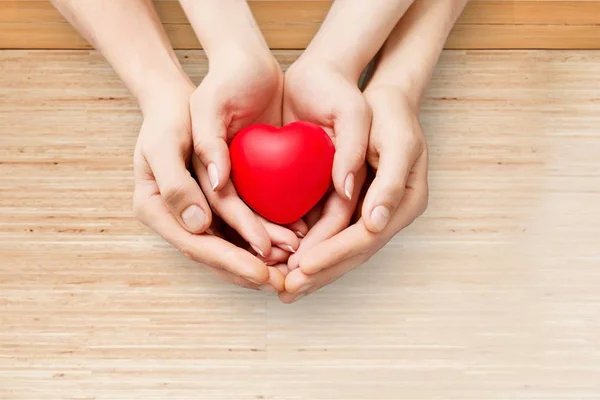 Red Heart in hands — Stock Photo, Image